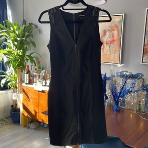 Bebe. Black front and back zip dress. Size S